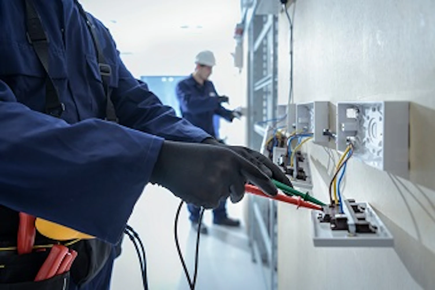 Electrical engineers testing electrical equipment