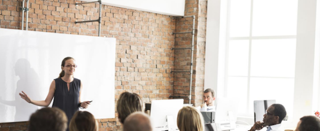 Female teaching in front of the class 684px
