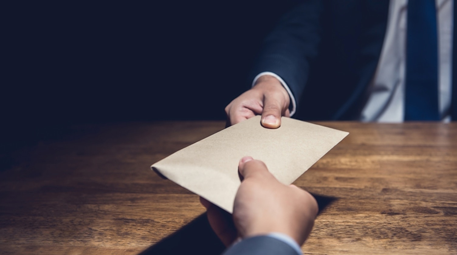 hero bribery concept with envelope