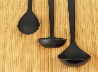 Kitchen tableware from black nylon on bamboo carpetshutterstock