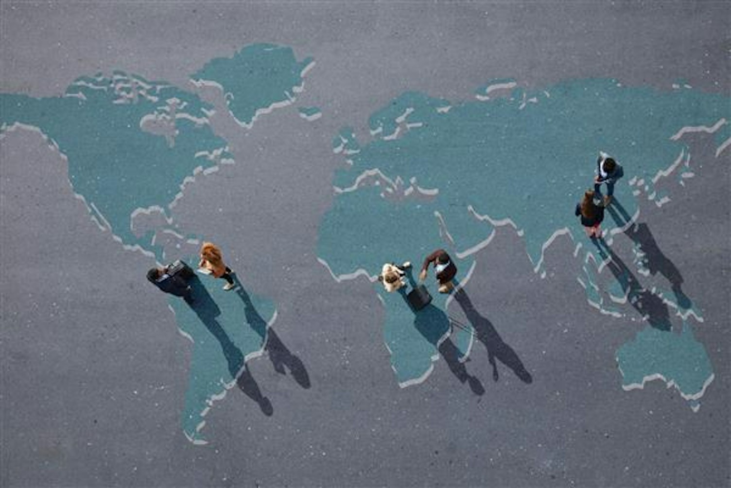 large Business people Standing on Painted World Map