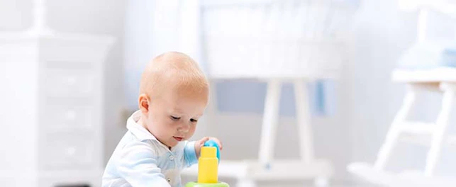 Main Feature Baby Playing with Colorful Toy Pyramid