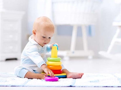 Main Feature Baby Playing with Colorful Toy Pyramid