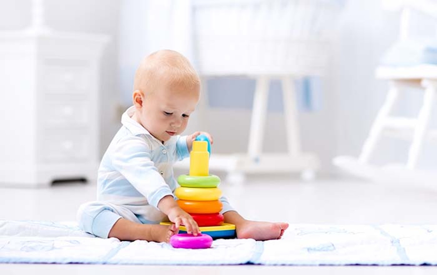 Main Feature Baby Playing with Colorful Toy Pyramid