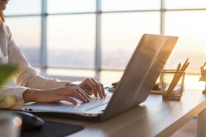 main feature business woman working at home using computer
