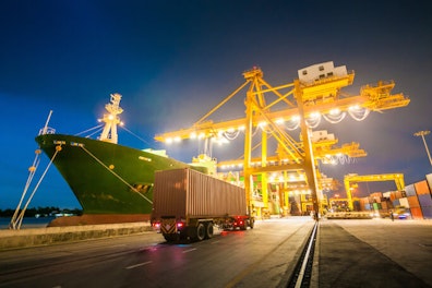 main feature cargo ship at port dusk