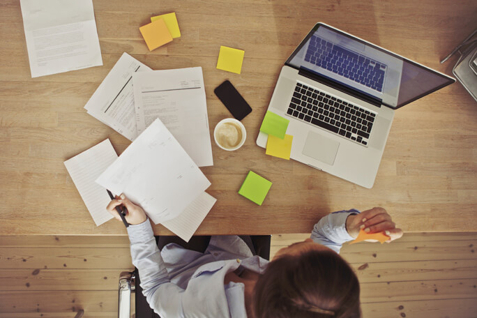 main feature woman working at desk