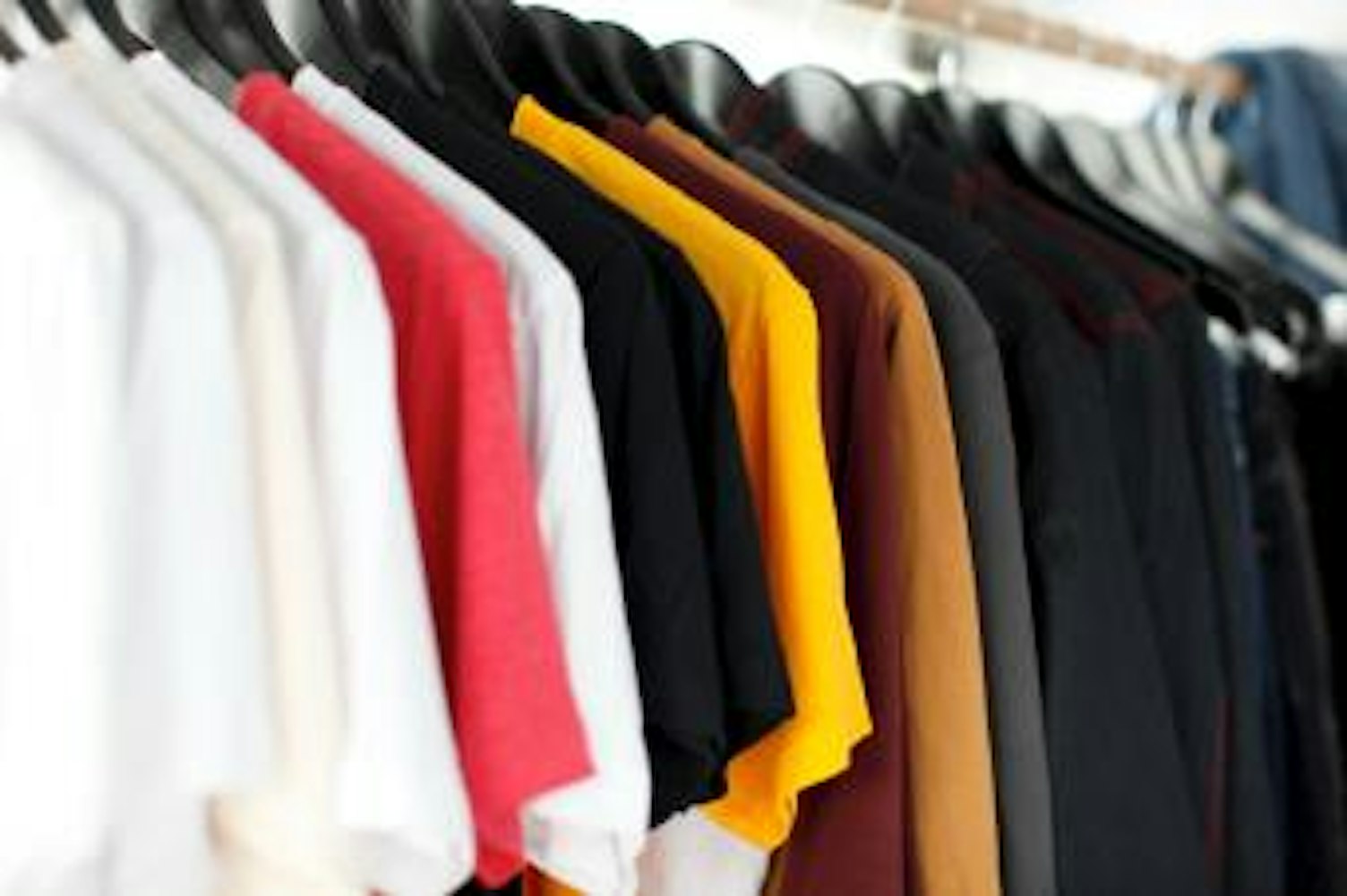 Assorted Shirts Hanged on Clothes Rack