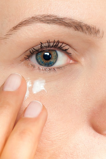 orig close up of woman putting eye cream
