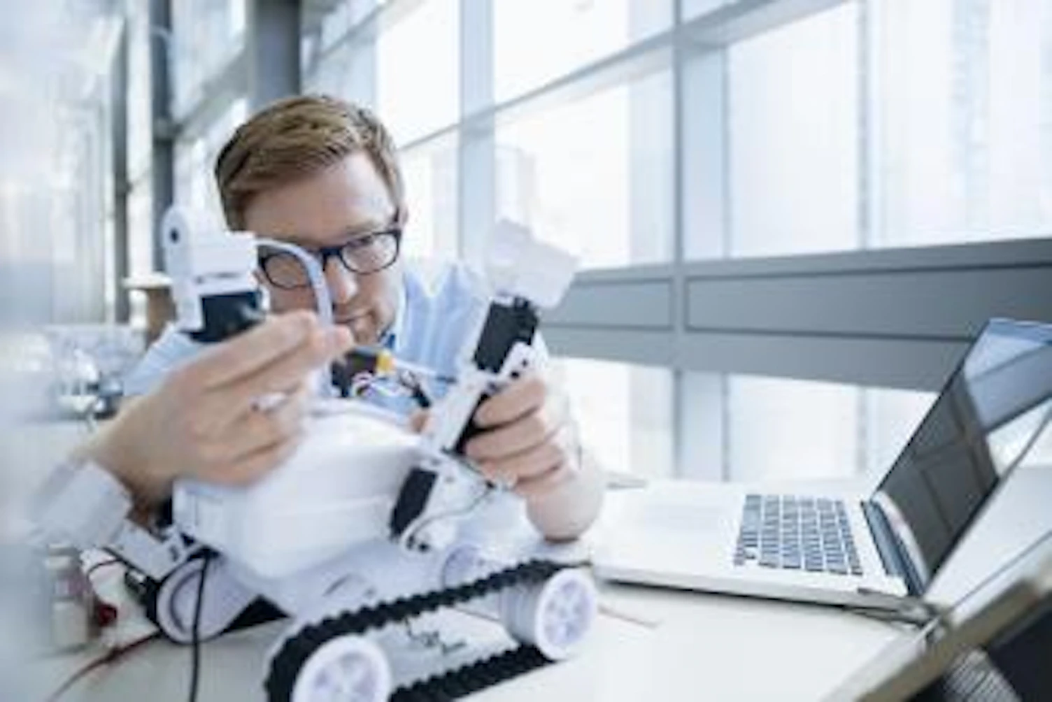 orig engineer examining robot