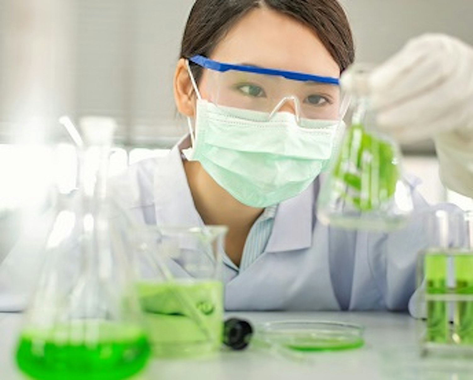 orig female scientist experimenting in laboratory