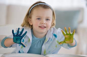 Girl Finger Painting with Colors 