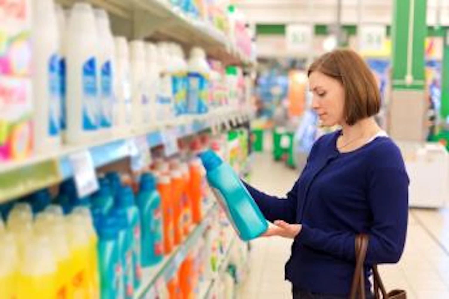 orig lady buying detergent in supermarket Getty507840170