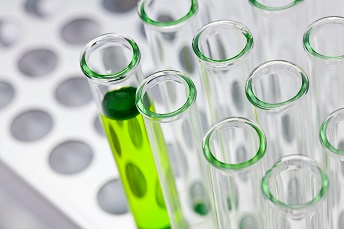 orig medical sciences test tubes in a metal rack close up
