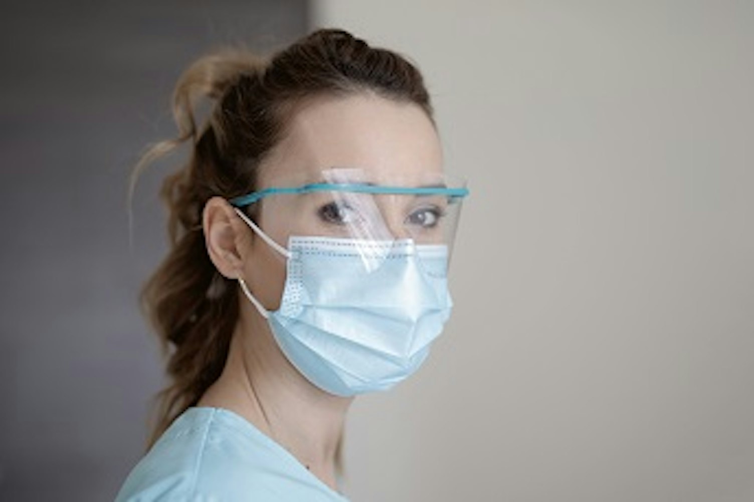 orig medical staff wearing safety visor and protective mask