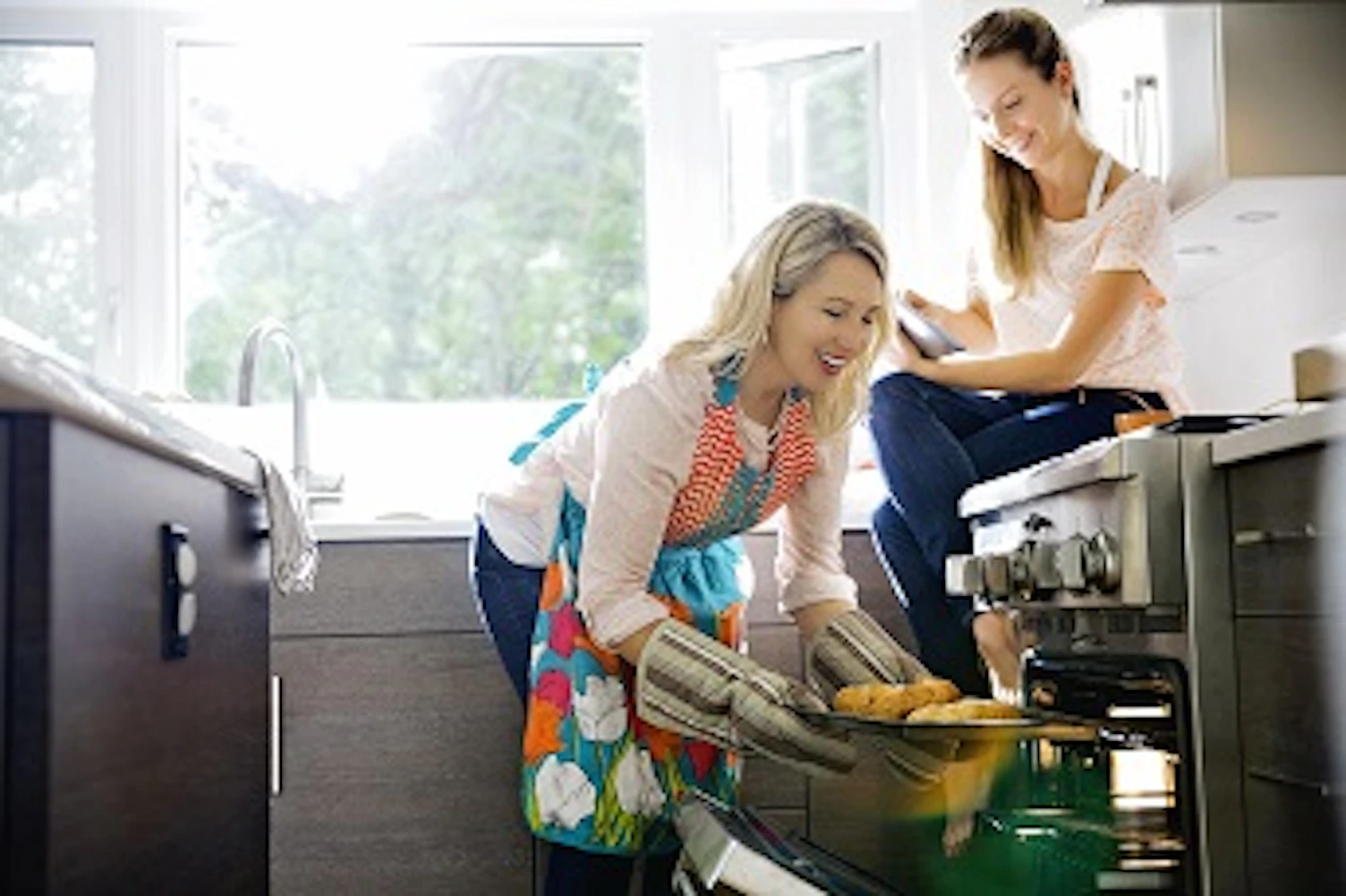orig mother and daughter baking croissants in kitchen 344