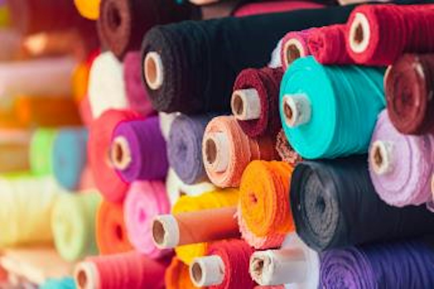 orig multi colored fabric rolls Getty1135741739