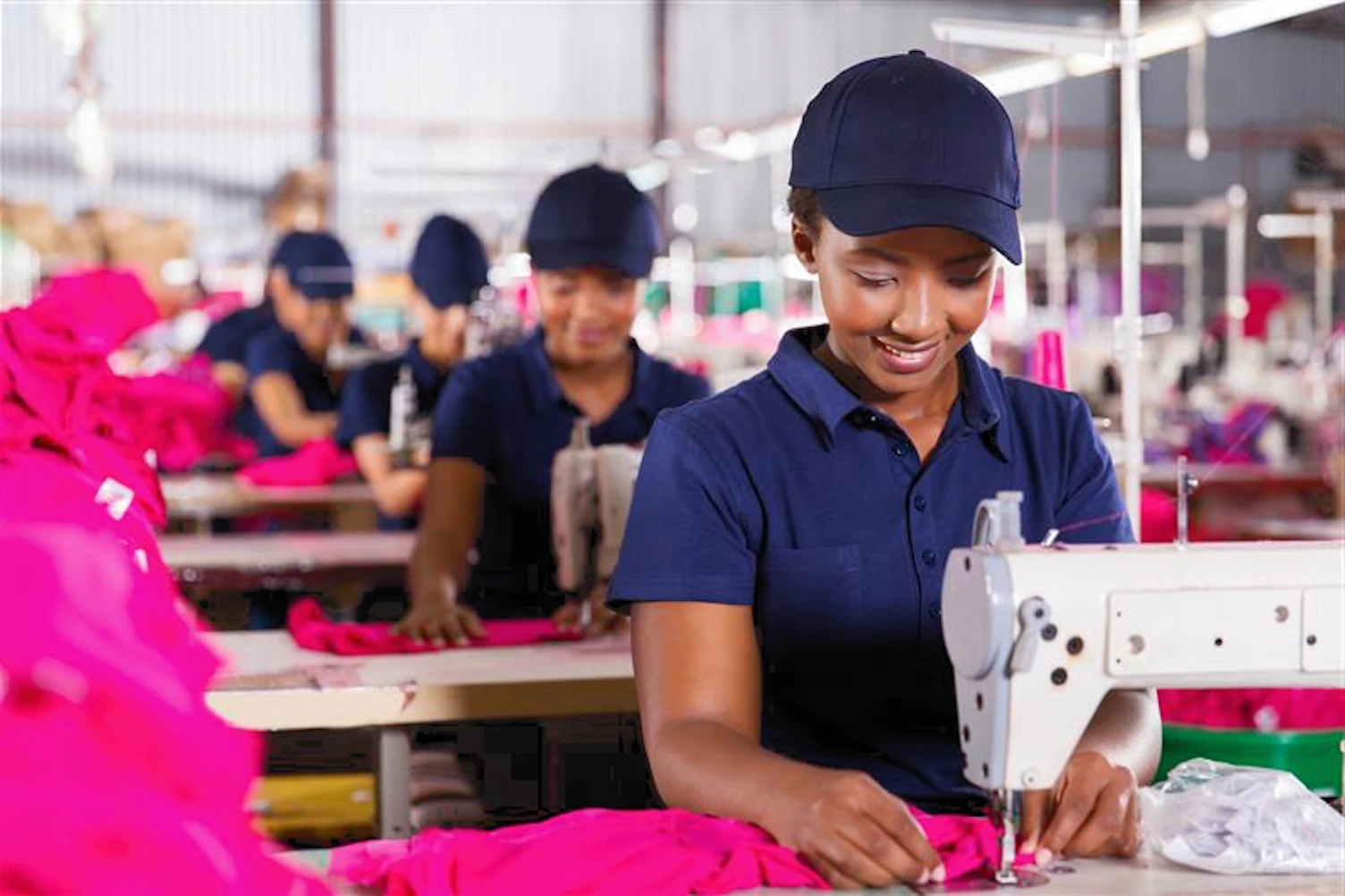 orig textile workers sewing on production lineGetty472214120