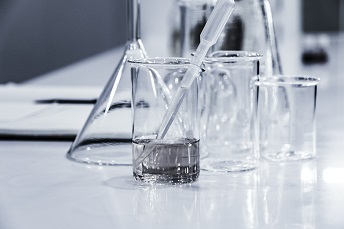 orig three clear beakers on tabletop unsplash