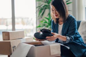 orig woman unboxing online purchases Getty1278393494