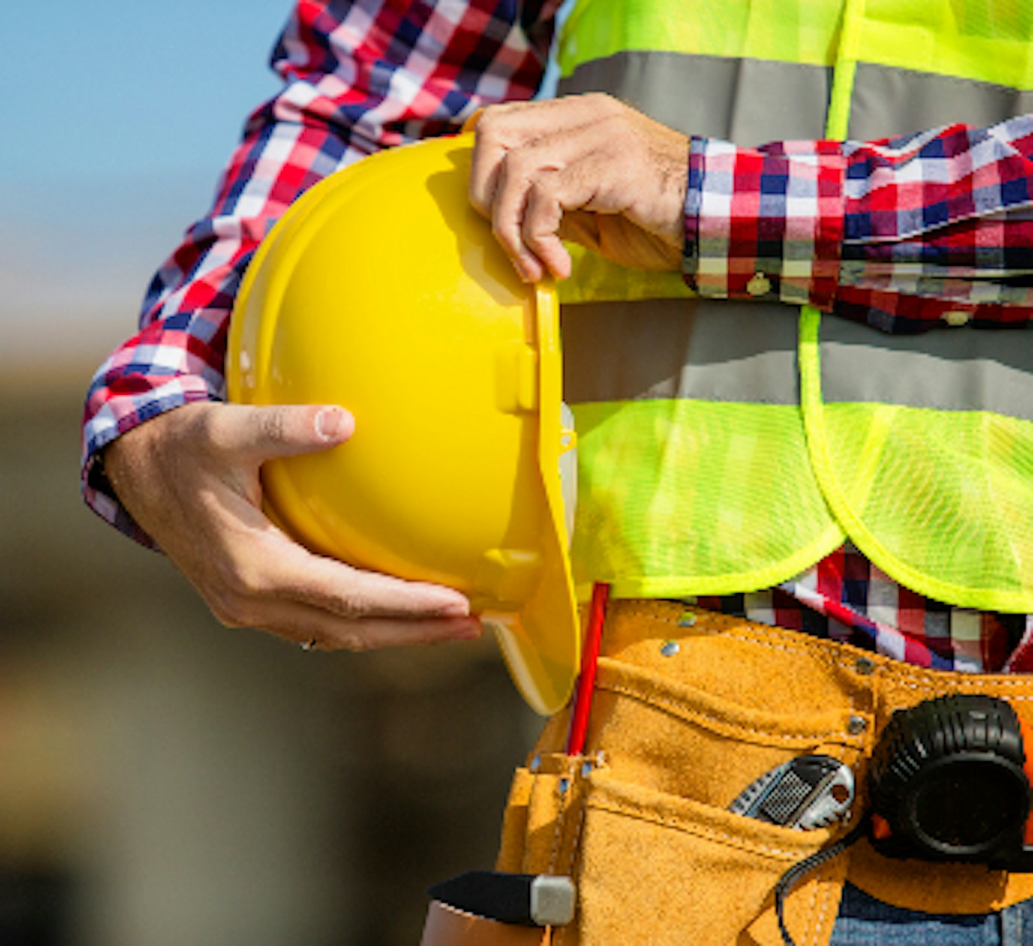 Orig Worker Holding Helmet Getty618948626 Copy