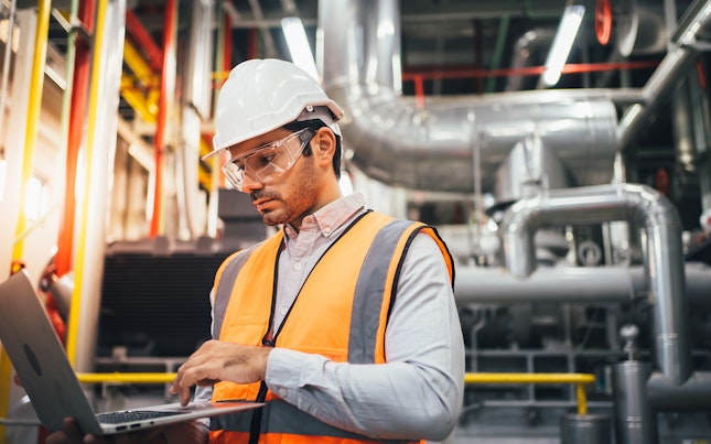 Auditor Inspecting a Factory