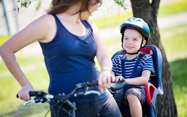 Boy Riding with his Mother on a Bicycle
