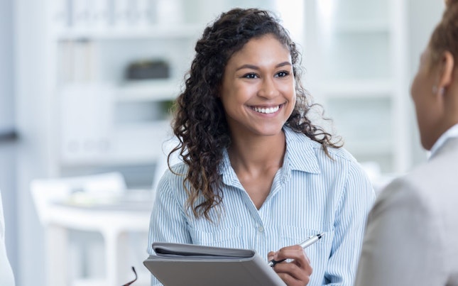 Man Holding External Battery and Smartphone