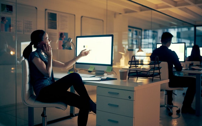 Man Holding External Battery and Smartphone