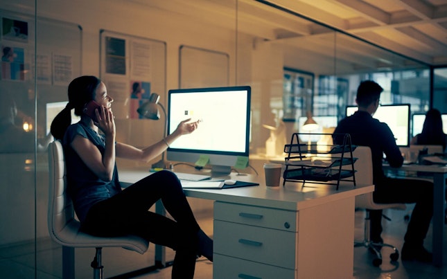 Man Holding External Battery and Smartphone