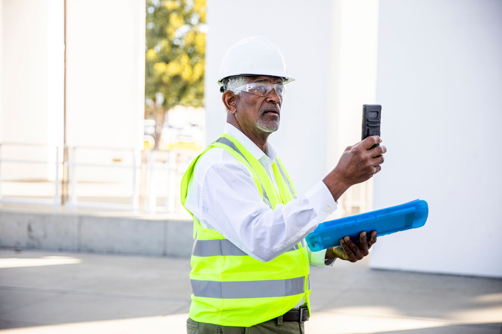 Construction Site Manager Inspecting Building