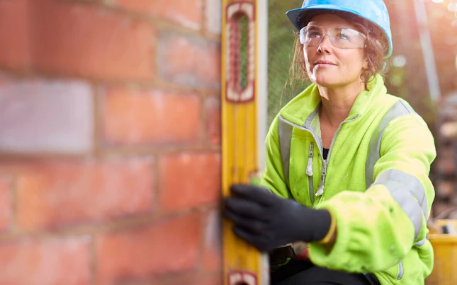 Construction Worker Building a Wall