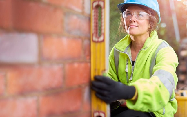Construction Worker Building a Wall