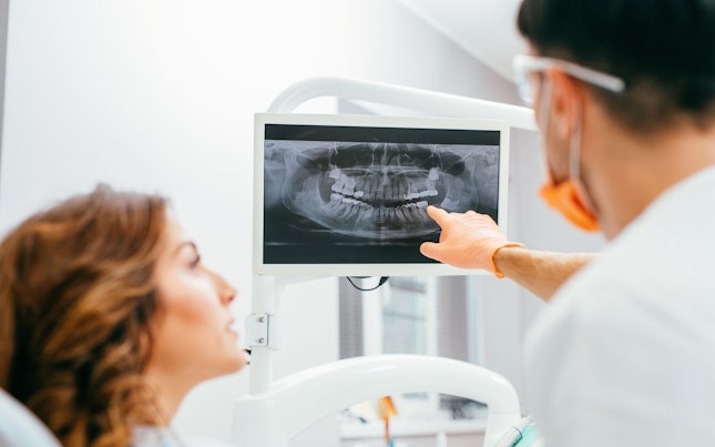 Doctors checking microorganism on big screen