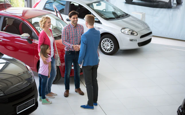 Family at Car Dealer Shop