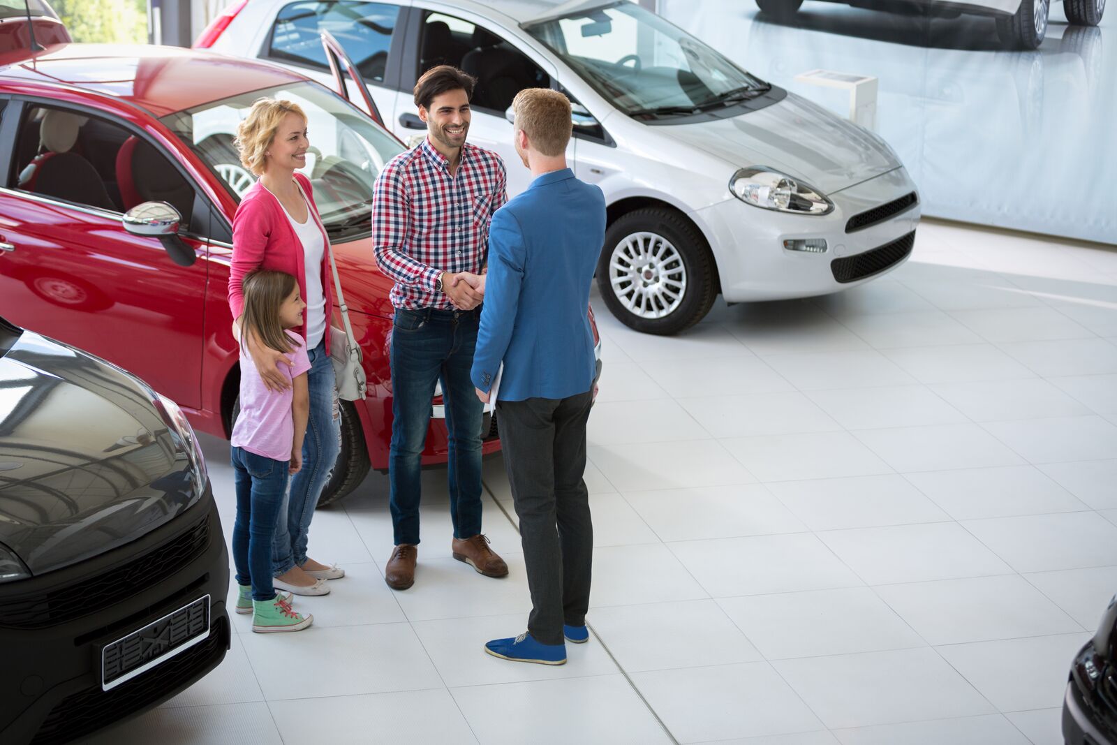 Family at Car Dealer Shop