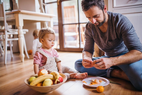 Father and Son Eating Fruits
