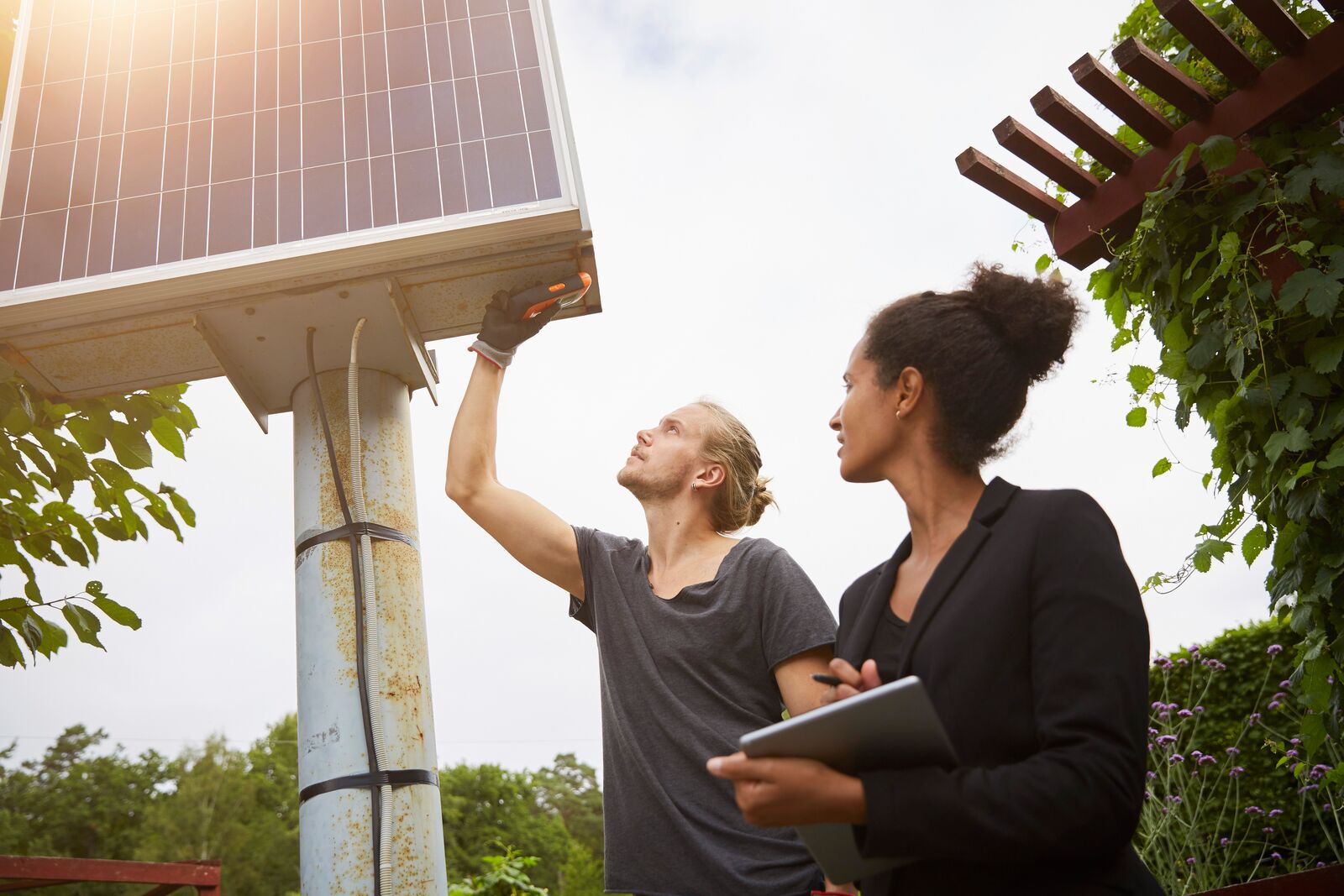 Garden Architect Adjusting Solar Panel
