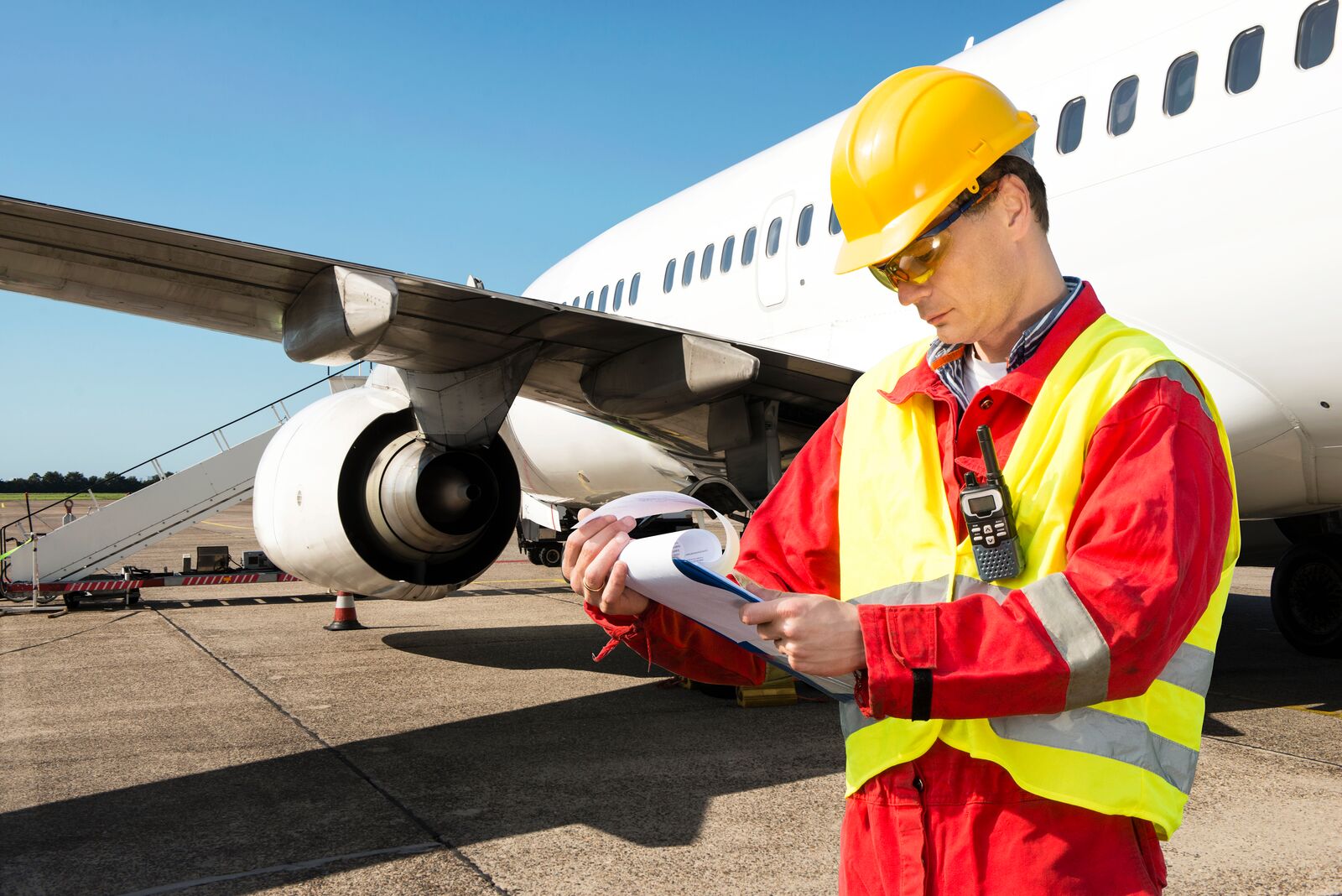 Handling Agent Checking Aircraft Paperwork