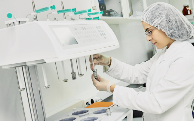 Female filling a small bottle