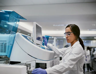 Hero Female Using Machinery in a Laboratory