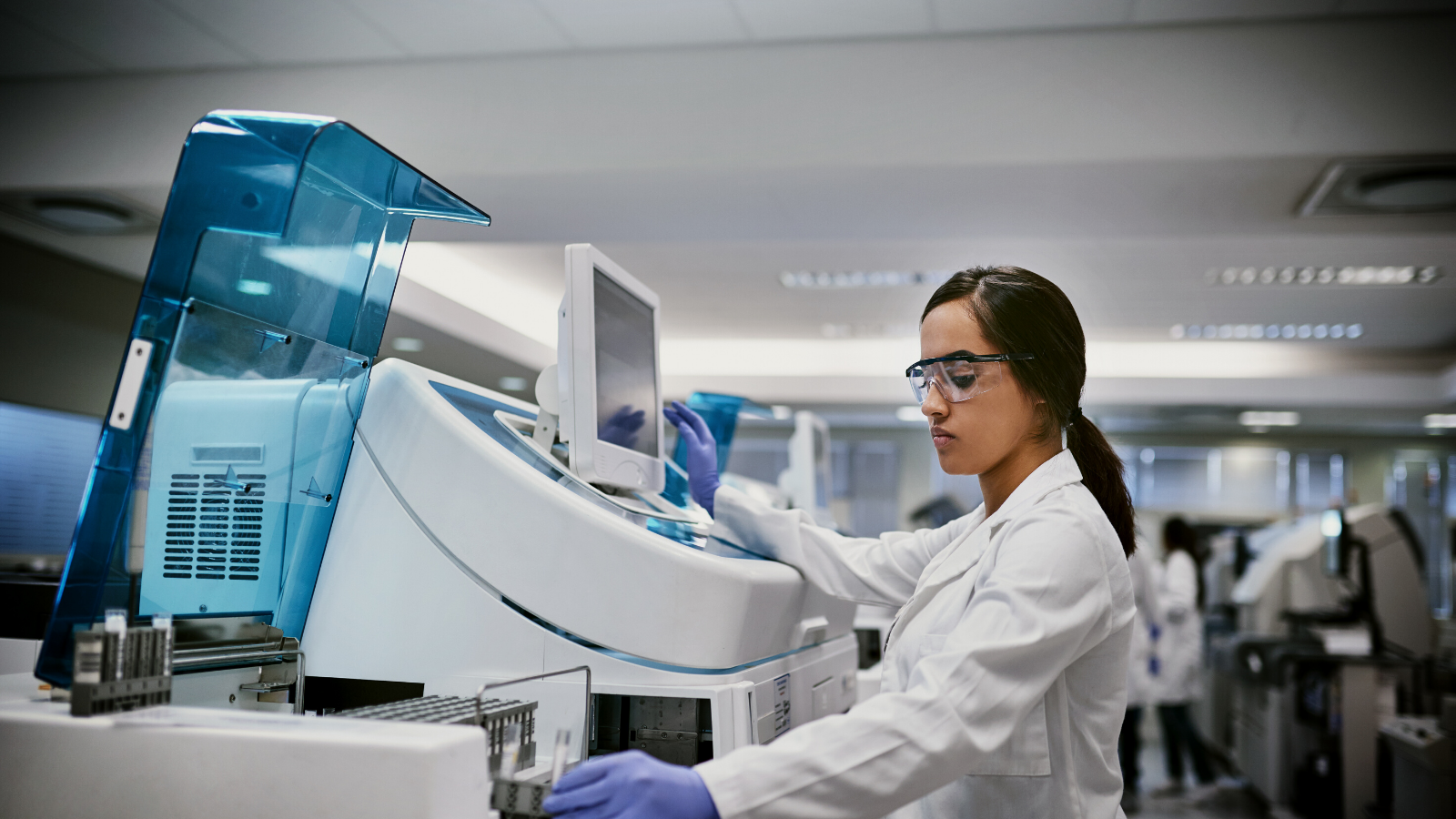 Hero Female Using Machinery in a Laboratory