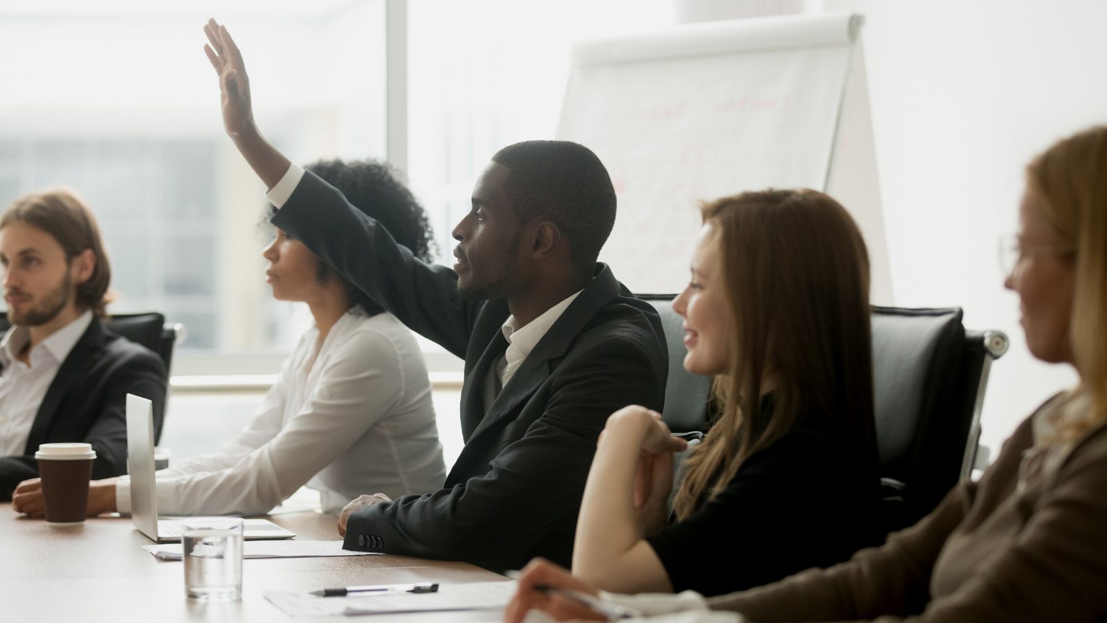 Male raising hand in a training