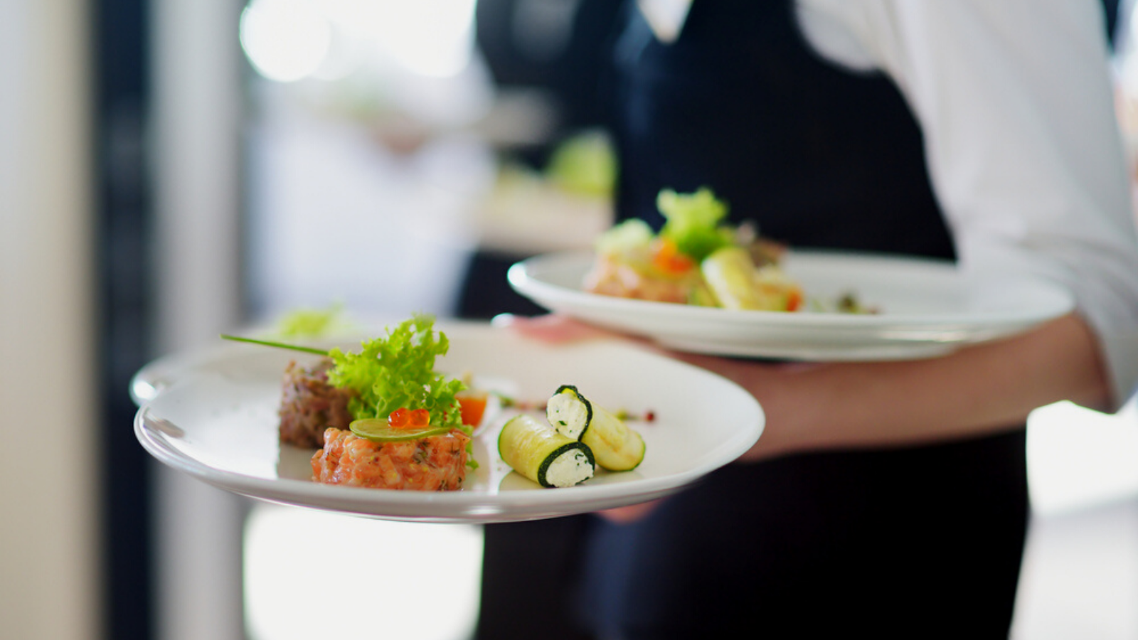Waiter serving food