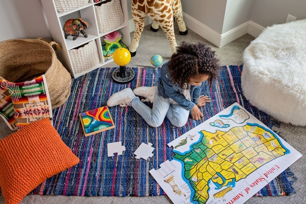 Little Girl Playing in her Room