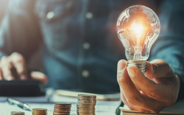Man holding light bulb