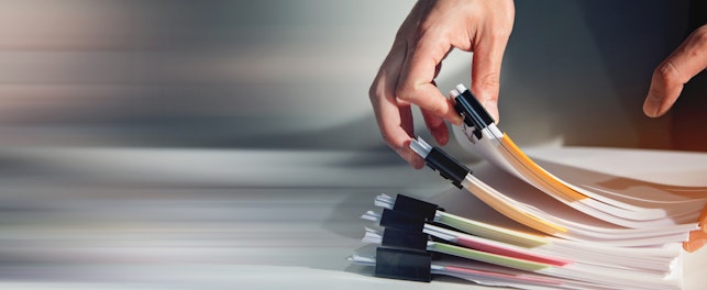 Man Sorting Document Report