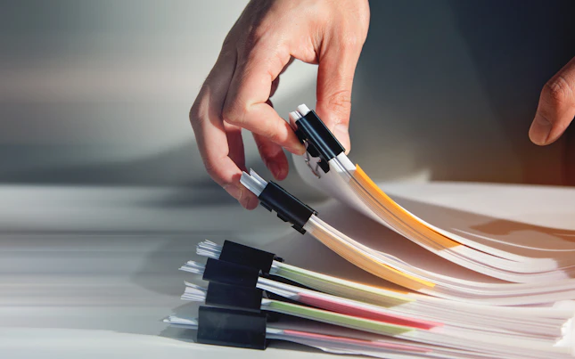 Man Sorting Document Report