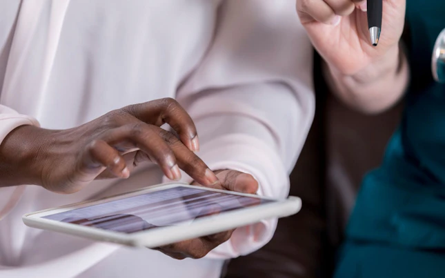 Patient Completing Medical Information on Digital Tablet
