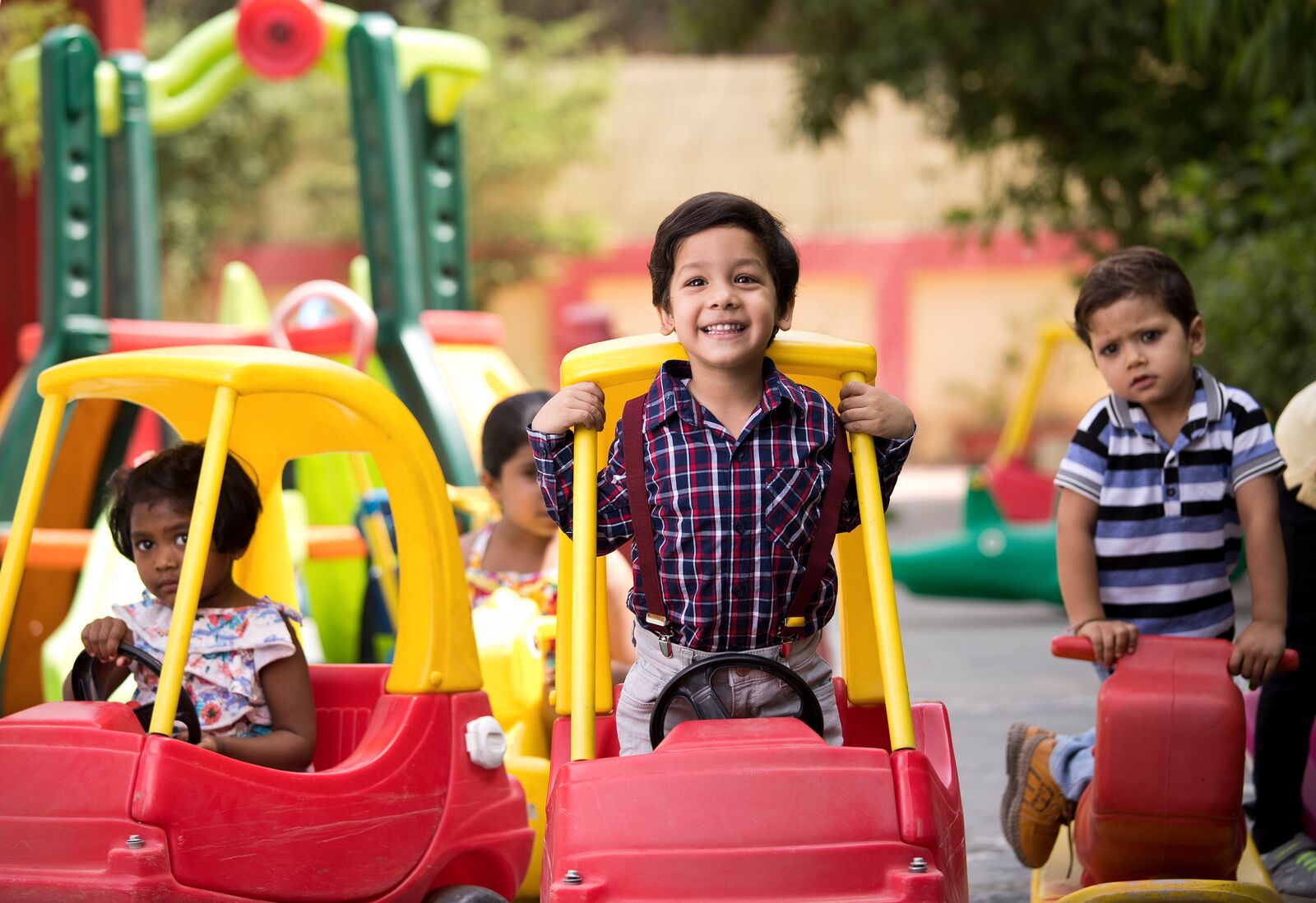 Preschool Kids Playing on Toy Car